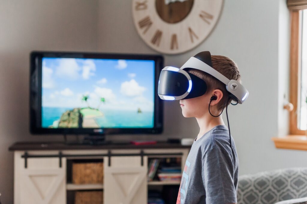 boy using virtual reality goggles 3391378