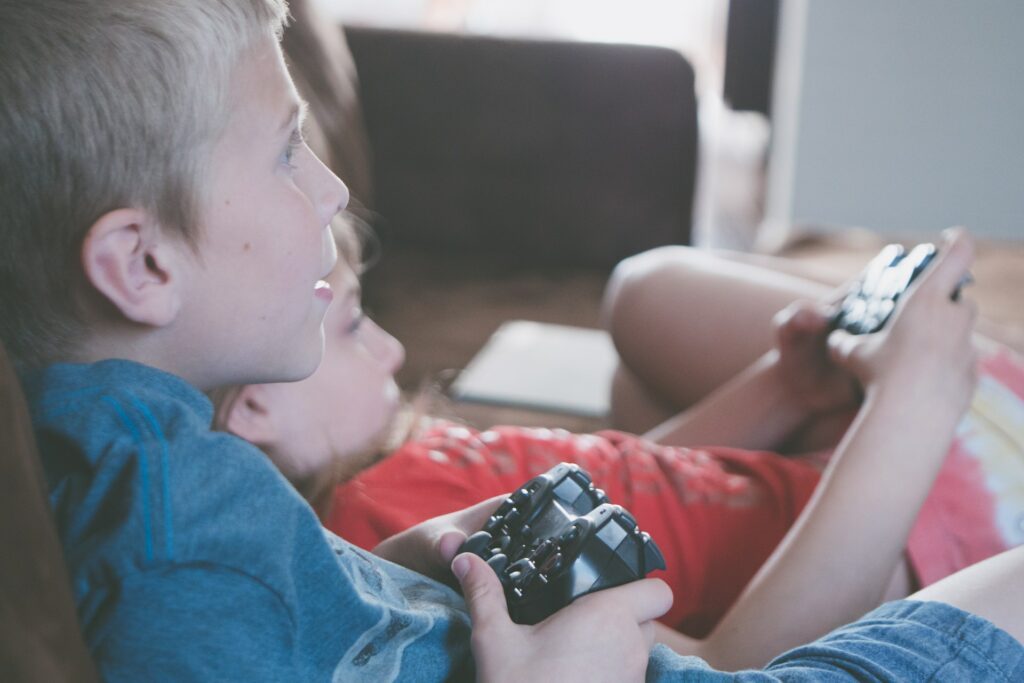 two boy and girl holding game controllers 1103563