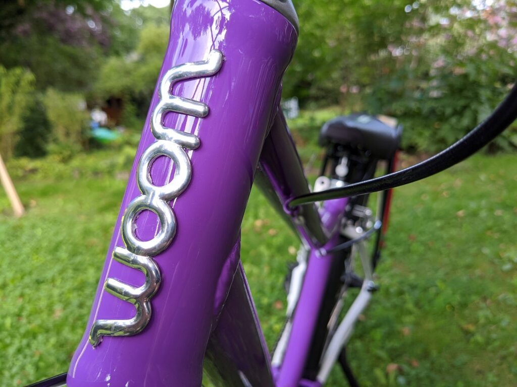 Woom 5 - Vollgas mit dem 24'' Kinderfahrrad 8 Woom Logo